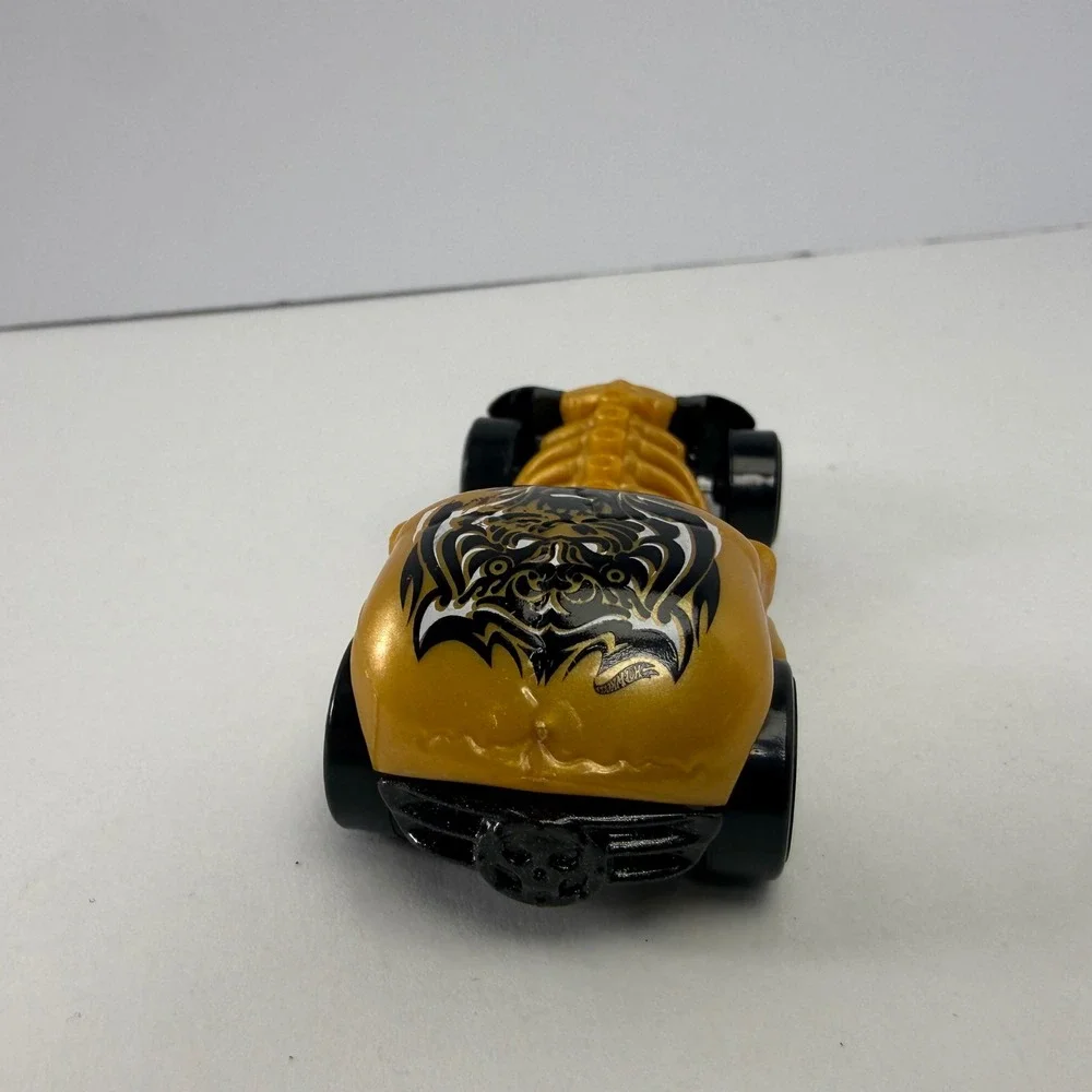 Hot Wheels Skull Crusher 2009 Mattel Gold Black Skeleton Diecast Car 1:64 Scale